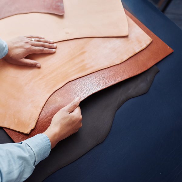 craftsman-choosing-leather-SR4MJDNa.jpg